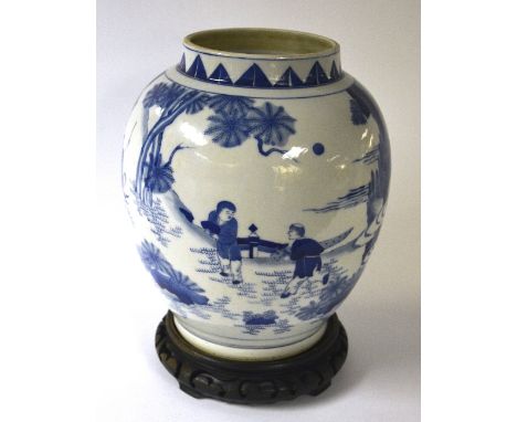 A Chinese blue and white ovoid vase, on hardwood stand, depicting typical Oriental figures in landscape, 27cm high (excluding