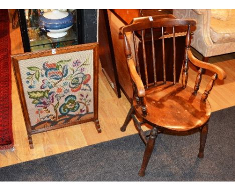 A vintage spindle back armchair, 89cm high, also with a firescreen with tapestry panel, 76cm high (2)