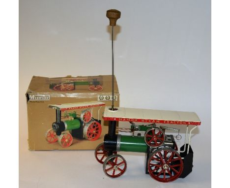 A Mamod toy steam tractor, in original fitted box, decorated in cream, red and green, 17cm high x 24cm wide x 12cm deep