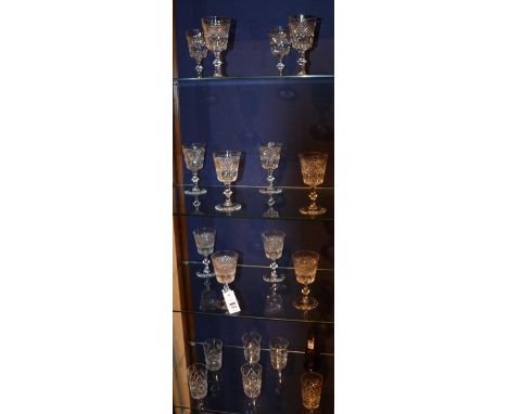 A set of 12 crystal wine glasses, with star and dimple decoration, raised on turned stem and circular foot, 6.5cm high, also 