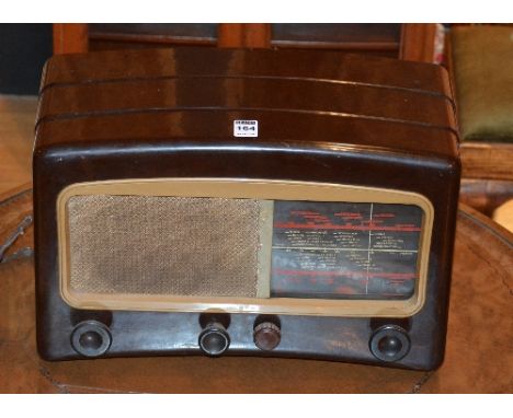 A 1930/40's Cossor Melody Maker wireless radio, in brown with cream speaker and dial, 27cm high x 41cm wide x 20cm deep