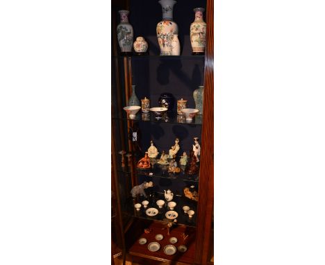 A large collection of 20th century Oriental ceramics and collectables, to include Satsuma vases, jars, bowls, carved hardwood