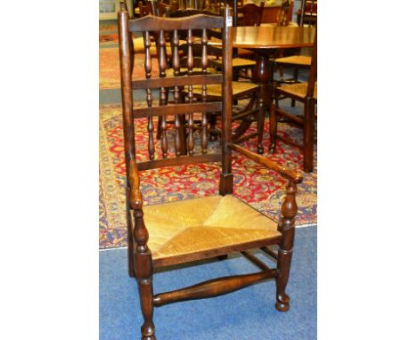 A Scottish style oak ladder back chair, with low rush seat, 101cm high