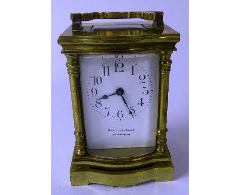 A brass carriage clock by Hamilton & Inches Edinburgh, the white enamel dial with Arabic numerals, 16cm high