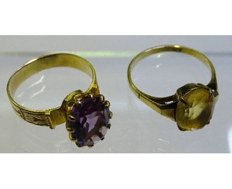 A 9ct gold citrine ring, stamped 9ct to underside, ring size M/N, 1.9g, together with a yellow metal amethyst ring, ring size