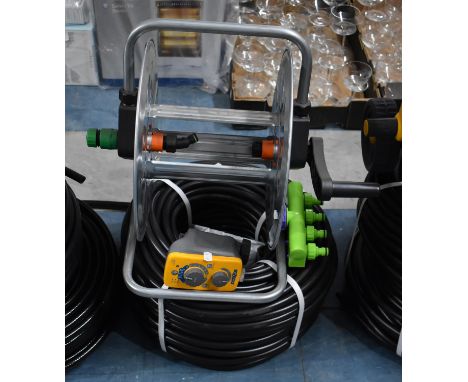 A Collection of New and Unused Garden Irrigation Equipment to Include Hoselock Timer Unit, Hose Pipe, Reel Stand etc 