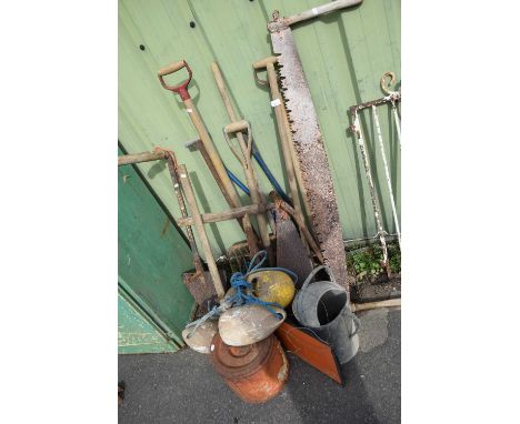 An assortment of garden and workshop tools, galvanised watering can, floats etc