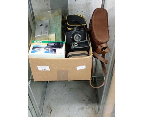 Collection of vintage cameras and related items