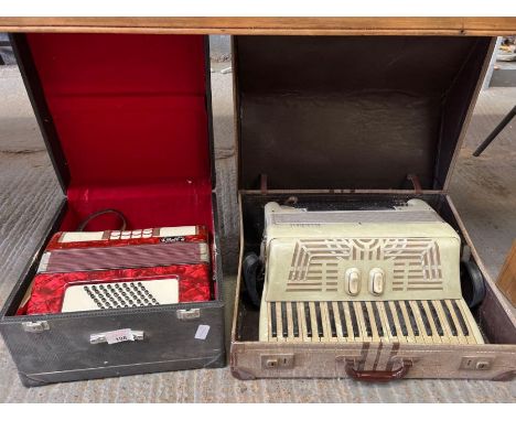 Cased Bell accordion along with a cased Accordiana accordion