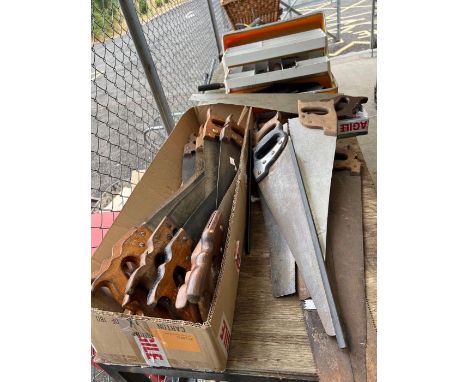 Collection of vintage tools including Spear and Jackson saws, chisels and other items