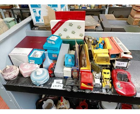 Part shelf of collectable cars including Tonka, Dinky, Playcraft etc along with ceramics and glassware