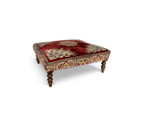 A large 19th century style flock tapestry covered footstool
The square padded seat on ring turned legs, 98cm square, 39cm hig