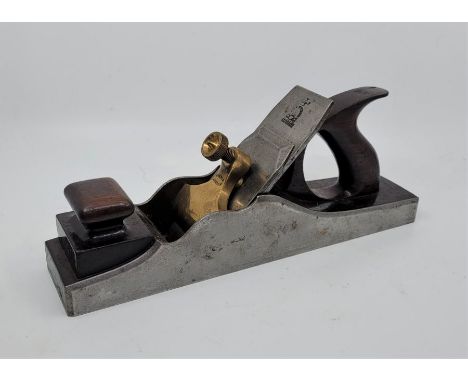 A Norris 13 1/2in. dovetailed steel panel plane, with rosewood infill and handle and Ward iron.Condition note: mouth and cutt