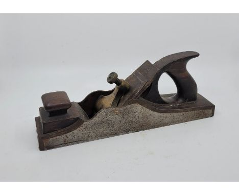 A Norris 13 1/2in. dovetailed steel panel plane, with rosewood infill and handle and Marples iron.