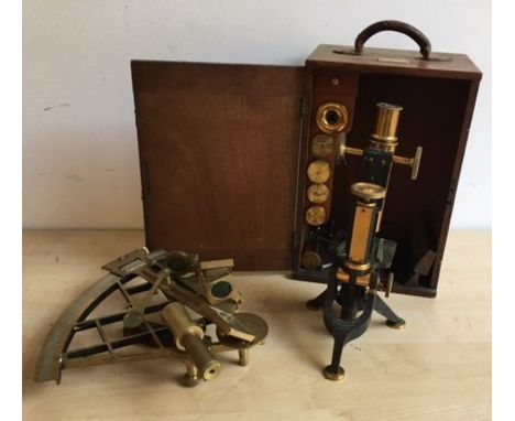 A 19th century microscope together with a 20th century theodolite. (2)