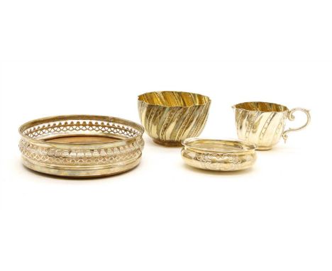 A silver coaster, together with a silver ladle bowl and a silver plated cream jug and sugar bowl (4)
