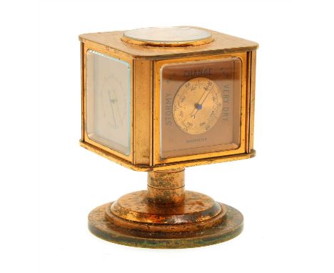 A coppered five dial swivel table compendium, with compass on top, clock, barometer, hygrometer and thermometer, 11.5cm high