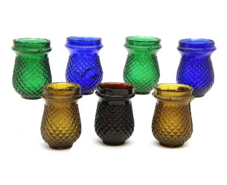 Seventeen Victorian coloured glass night light holders, each 10cm high