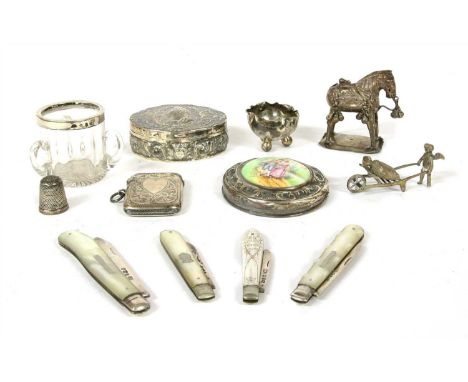 A box of silver items , including an oval Continental portrait box, four mother of pearl handles fruit knives and vesta, etc