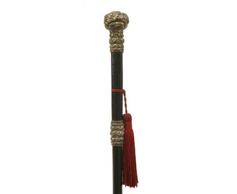 A silver and ebonised wood walking stick , late 19th century, the repoussé decorated knob centred with a fox's head, with a t