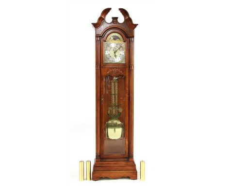 A Howard Miller longcase clock, with three train triple weight movement, moon phase dial and visible pendulum, 216cm high