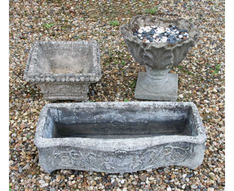Three composition stone planters, the trough measuring 75cm wide