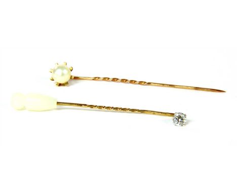 A 9ct gold diamond stick pin, with a brilliant cut diamond, estimated as approximately 0.28ct, four claw set in white collet 