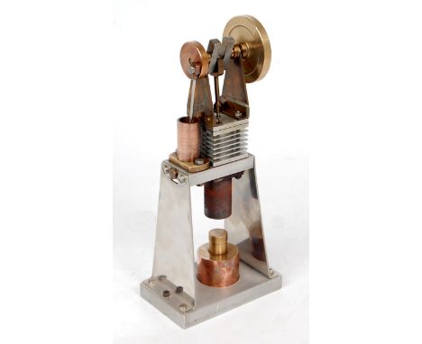 A propriety built from brass and steel vertical hot air engine, fitted with stirling cycle, free running