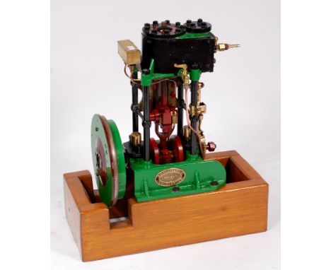 A Mumford of Colchester Single cylinder vertical marine engine, comprising of single vertical cylinder supported via 4 pillar