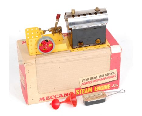 Meccano boxed Horizontal Steam engine, comprising of tin housed boiler, with burner, powering a small spoked fly wheel, with 