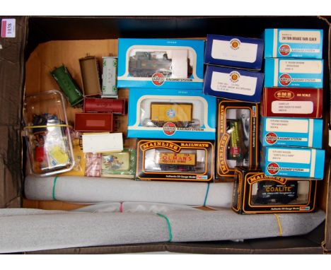 A tray containing an Airfix ex GWR 0-4-2T No. 1466 in BR green (G,BG), 11 boxed wagons by Bachmann, Airfix and Mainline (all 