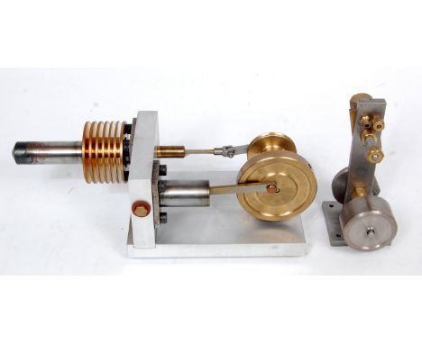 A propriety built from brass and steel construction hot air stirling cycle engine, fitted with a small 1.5 inch take off pull