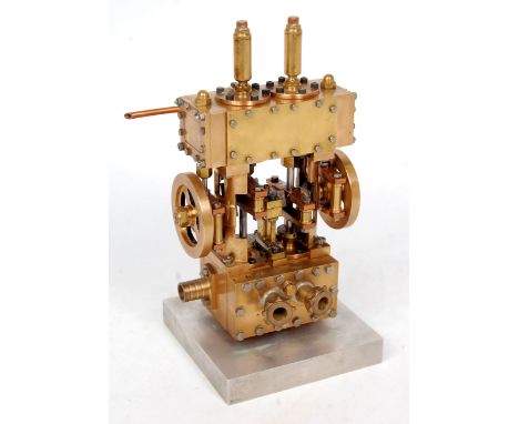 A very well engineered live steam twin cylinder vertical engine, constructed from brass, copper and gun metal components, thi