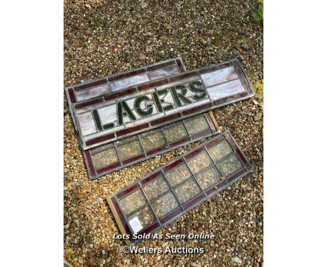 FOUR LEAD LIGHT WINDOWS INCUDING  A LARGER 'LAGER' ORIGINALY FROM A BAR, TWO ARE 58.5CM X 21CM THE OTHER IS 55.5CM X 21.5CM /