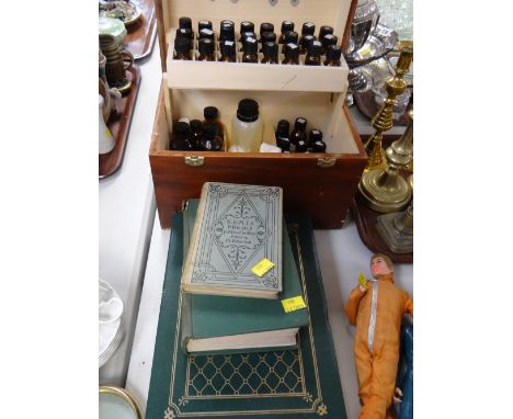 A cased homeopathy set & an album of vintage postcards etc