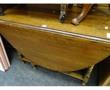 A large drop leaf barley-twist gate leg table