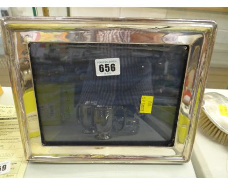 A plain silver easel portrait frame