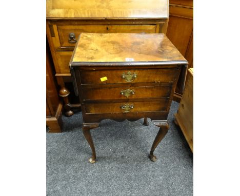 An antique / reproduction three-drawer twin flap table