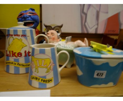 A selection of novelty pottery items including milk jug, teapot, butter dish etc