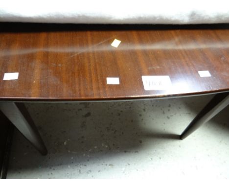 An antique mahogany foldover tea table