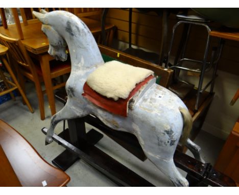 A vintage rocking horse with accessories (separated from stand)condition:There is general wear, a few cracks but is structura