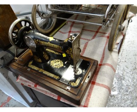 A vintage Singer cased sewing machine
