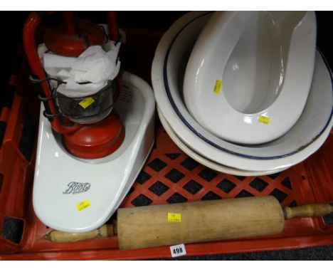 A crate of items including a large wooden rolling pin, two slipper bed pans including one for Boots the Chemist together with