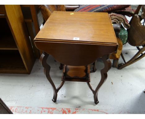 A drop flap occasional table with planter stand base