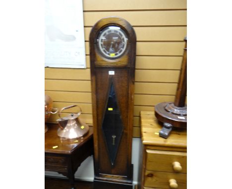 A vintage polished dome top grandmother clock