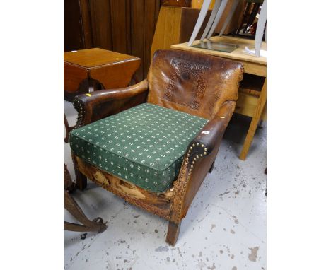 A vintage brown leather armchair (distressed)