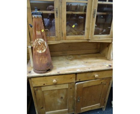 A compact semi-glazed vintage pine dresser