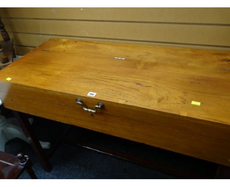 A vintage coffin table with lift up top