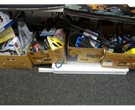 Four boxes of as new cycling accessories including saddles, helmets, lighting, bottles etc