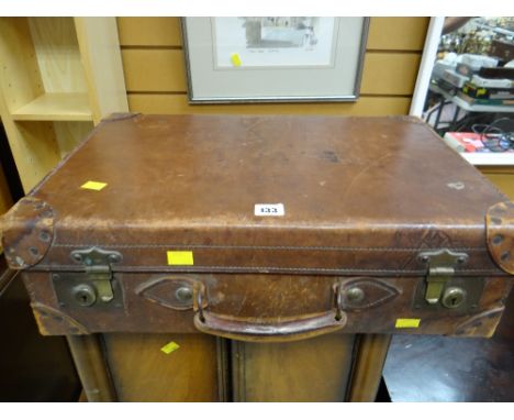 A vintage brown leather suitcase